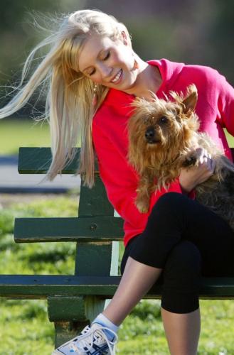 Girl with dog on park bench