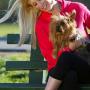 Girl with dog on park bench